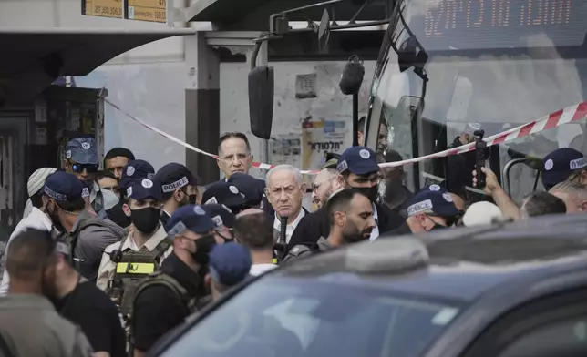 Israeli Prime Minister Benjamin Netanyahu visits the site of a shooting attack where several people killed and injured at a bus stop in Jerusalem, Monday, Sept. 8, 2025. (AP Photo/Mahmoud Illean)