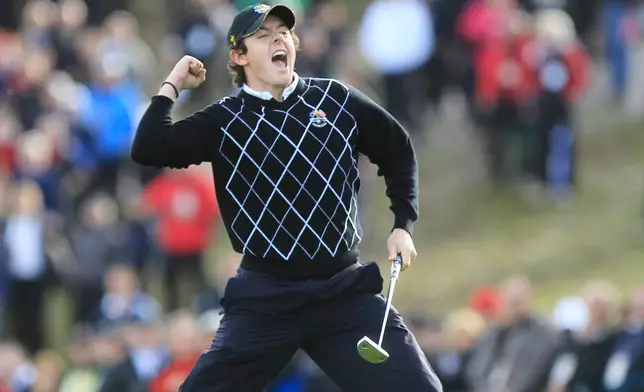 FILE - Europe's Rory McIlroy reacts after winning the 17th hole on the second day of the 2010 Ryder Cup golf tournament at the Celtic Manor Resort in Newport, Wales, Saturday, Oct. 2, 2010. (AP Photo/Peter Morrison, File)