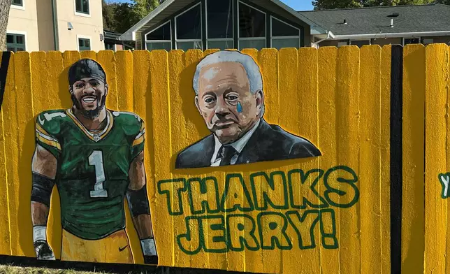 A sign outside a home across the street from Lambeau Field thanks Dallas Cowboy's owner Jerry Jones for trading Micah Parsons to the Green Bay Packers in Green Bay, Wis., on Thursday, Sept. 25, 2025. (AP Photo/Steve Megargee)