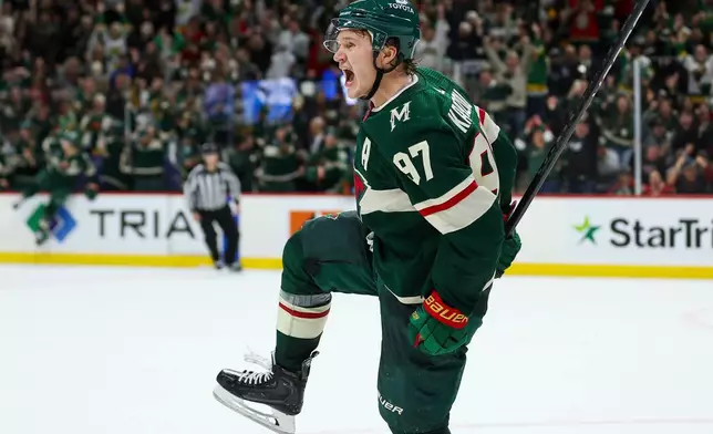 FILE - Minnesota Wild left wing Kirill Kaprizov (97) celebrates after his winning goal against the Montreal Canadiens during overtime of an NHL hockey game Thursday, Dec. 21, 2023, in St Paul, Minn. (AP Photo/Matt Krohn, File)