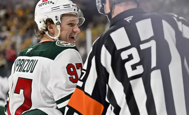FILE - Minnesota Wild left wing Kirill Kaprizov (97) talks with referee Eric Furlatt (27) during Game 5 of a first-round NHL hockey playoff series against the Vegas Golden Knights April 29, 2025, in Las Vegas. (AP Photo/David Becker File)