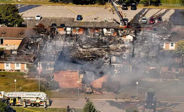 Emergency crews respond to a shooting and fire at The Church of Jesus Christ of Latter-day Saints, in Grand Blanc, Mich., Sept. 28, 2025. (David Guralnick/Detroit News via AP)