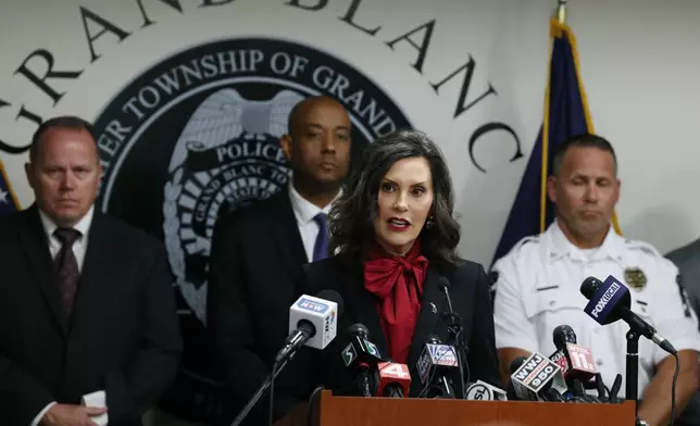 Michigan Gov. Gretchen Whitmer addresses the media, regarding the shooting at the Church of Jesus Christ of Latter-day Saints, during a news conference at the Grand Blanc Township police, Monday, Sept. 29, 2025 in Grand Blanc Township, Mich. (AP Photo/Carlos Osorio)