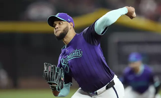 Arizona Diamondbacks starting pitcher Eduardo Rodriguez throws against the Boston Red Sox during the first inning of a baseball game Friday, Sept. 5, 2025, in Phoenix. (AP Photo/Ross D. Franklin)