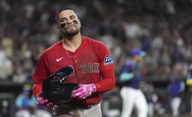 Boston Red Sox's Carlos Narváez pauses on the field after being tagged out at home plate against the Arizona Diamondbacks during the third inning of a baseball game Friday, Sept. 5, 2025, in Phoenix. (AP Photo/Ross D. Franklin)