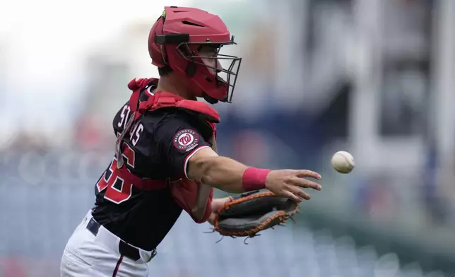 Washington Nationals catcher CJ Stubbs throws out Miami Marlins' Xavier Edwards at first base during the first inning of a baseball game at Nationals Park, Monday, Sept. 1, 2025, in Washington. This marks Stubbs' Major League debut. (AP Photo/Jess Rapfogel)