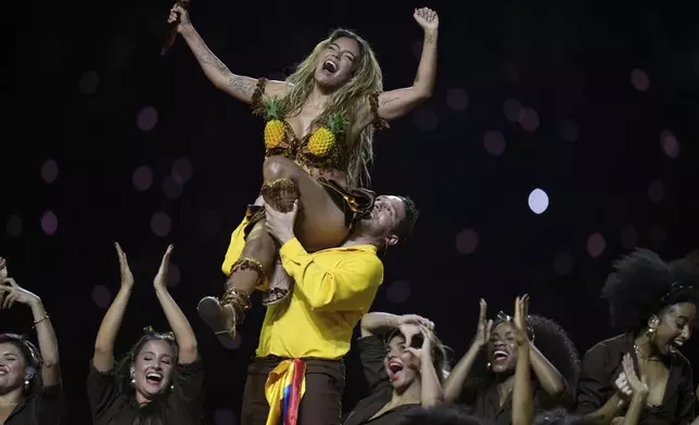KAROL G performs during halftime at an NFL football game between the Kansas City Chiefs and the Los Angeles Chargers, Friday, Sept. 5, 2025, in Sao Paulo. (AP Photo/Andre Penner)