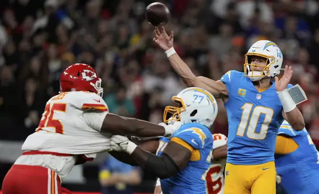Los Angeles Chargers quarterback Justin Herbert throws a touchdown pass against the Kansas City Chiefs during the first half of an NFL football game, Friday, Sept. 5, 2025, in Sao Paulo. (AP Photo/Doug Benc)
