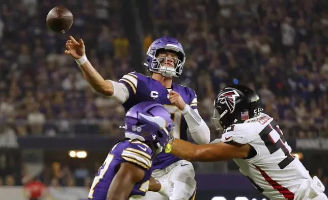 Minnesota Vikings quarterback J.J. McCarthy (9) passes the ball during the first half of an NFL football game against the Atlanta Falcons, Sunday, Sept. 14, 2025, in Minneapolis. (AP Photo/Bruce Kluckhohn)