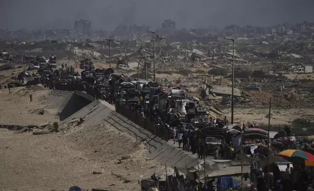 Displaced Palestinians flee northern Gaza along the coastal road toward the south, after Israel's military says its expanded operation in Gaza City has begun and warns residents to leave, Tuesday, Sept. 16, 2025. (AP Photo/Abdel Kareem Hana)