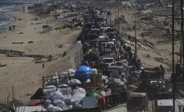 Displaced Palestinians flee northern Gaza along the coastal road toward the south, after Israel's military says its expanded operation in Gaza City has begun and warns residents to leave, Tuesday, Sept. 16, 2025. (AP Photo/Abdel Kareem Hana)