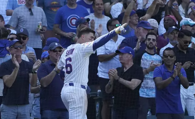 Chicago Cubs' Matt Shaw gestures after scoring against the Tampa Bay Rays during the seventh inning of a baseball game Sunday, Sept. 14, 2025, in Chicago. (AP Photo/David Banks)