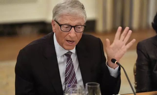 Microsoft's Bill Gates speaks during a dinner with President Donald Trump in the State Dinning Room of the White House, Thursday, Sept. 4, 2025, in Washington. (AP Photo/Alex Brandon)
