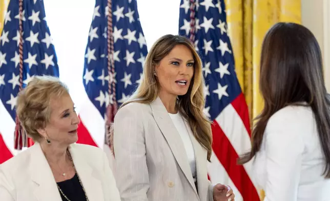 First lady Melania Trump, center speaks with Education Secretary Linda McMahon, left, and Agriculture Secretary Brooke Rollins, after a meeting of the White House Task Force on Artificial Intelligence Education in the East Room of the White House, Thursday, Sept. 4, 2025, in Washington. (AP Photo/Alex Brandon)