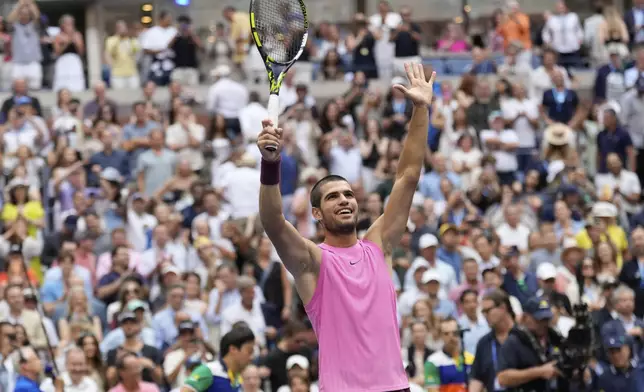 Carlos Alcaraz, of Spain, celebrates after defeating Novak Djokovic, of Serbia, during the men's singles semifinals of the U.S. Open tennis championships, Friday, Sept. 5, 2025, in New York. (AP Photo/Seth Wenig)