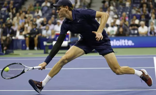 Jannik Sinner, of Italy, returns a shot to Lorenzo Musetti, of Italy, during the quarterfinal round of the U.S. Open tennis championships, Wednesday, Sept. 3, 2025, in New York. (AP Photo/Adam Hunger)