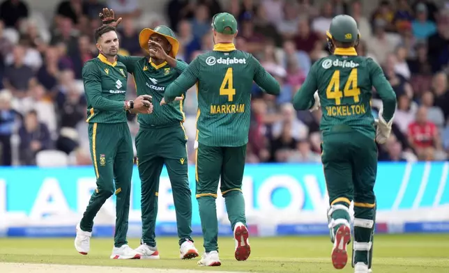 South Africa's Keshav Maharaj, left, and his teammates celebrate the wicket of England's Will Jacks during the One Day International Series cricket match between England and South Africa at Headingley, Leeds, England, Tuesday, Sept. 2, 2025. (Danny Lawson/PA via AP)