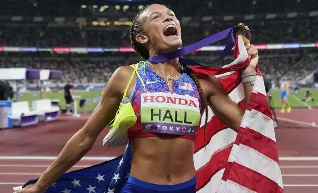 United States' Anna Hall reacts after winning the heptathlon 800 meters at the World Athletics Championships in Tokyo, Saturday, Sept. 20, 2025. (AP Photo/Eugene Hoshiko)
