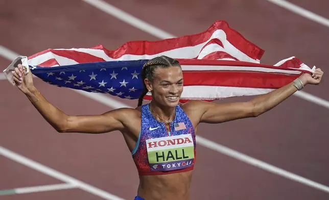 United States' Anna Hall celebrates after winning the gold medal in the heptathlon at the World Athletics Championships in Tokyo, Saturday, Sept. 20, 2025. (AP Photo/Abbie Parr)