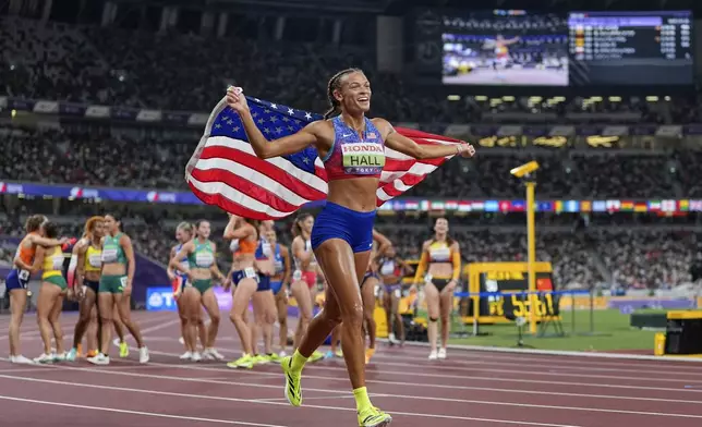 United States' Anna Hall celebrates after wining the gold in the heptathlon at the World Athletics Championships in Tokyo, Saturday, Sept. 20, 2025. (AP Photo/Petr David Josek)