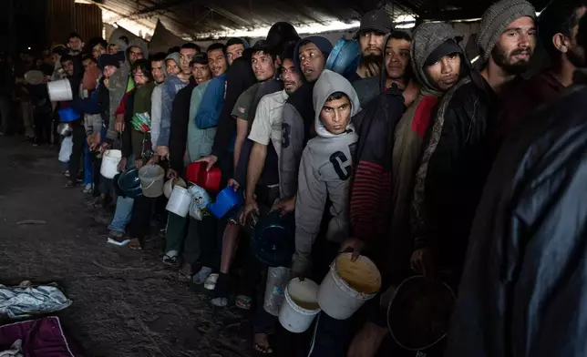 FILE PHOTO GALLERY - Inmates line up for a jail-provided meal known as "vori-vori" at the Tacumbu prison in Asuncion, Paraguay, July 10, 2024. (AP Photo/Rodrigo Abd)