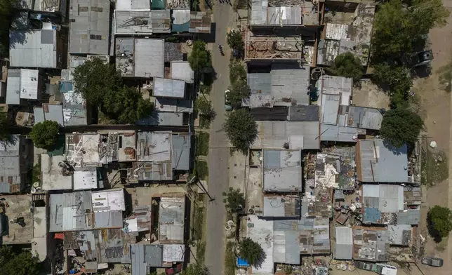 FILE PHOTO GALLERY - An aerial view of Los Pumitas neighborhood, where an 11-year-old boy was fatally shot at a birthday party in Rosario, Argentina, March 7, 2023. Three other children, including a 2-year-old, were injured during the attack. (AP Photo/Rodrigo Abd)