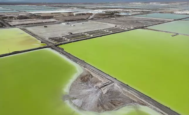 FILE PHOTO GALLERY - Brine evaporates in pools at the lithium extraction plant facilities of the SQM Lithium company near Peine, Chile, April 18, 2023. In the "lithium triangle" – a region spanning Argentina, Chile and Bolivia – native communities sit upon a treasure trove of the stuff: an estimated trillion dollars in lithium. (AP Photo/Rodrigo Abd)