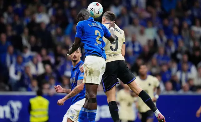 Barcelona's Robert Lewandowski scores his side's second goal during a Spanish La Liga soccer match at the Carlos Tartiere stadium in Oviedo, Spain, Thursday, Sept. 25, 2025. (AP Photo/Jose Breton)