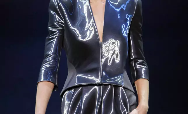 FILE - A model wears a creation of Italian designer Giorgio Armani for his Haute Couture Spring-Summer fashion collection presented in Paris, Monday, Jan. 24, 2011. (AP Photo/ Francois Mori, file)