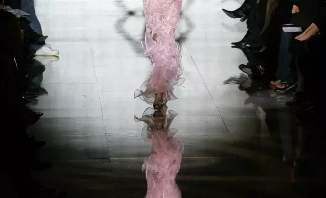 FILE - A model wears a creation by Italian fashion designer Giorgio Armani during the presentation of the Giorgio Armani Prive Haute Couture spring-summer 2008 fashion collection, Jan. 21, 2008 in Paris. (AP Photo/Thibault Camus, file)