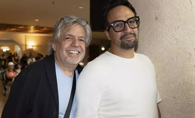 Lin-Manuel Miranda, right, poses with his father, Luis A. Miranda Jr., during the closing event of the Flamboyan Arts Fund in San Juan, Puerto Rico, Saturday, Sept. 13, 2025. (AP Photo/Alejandro Granadillo)