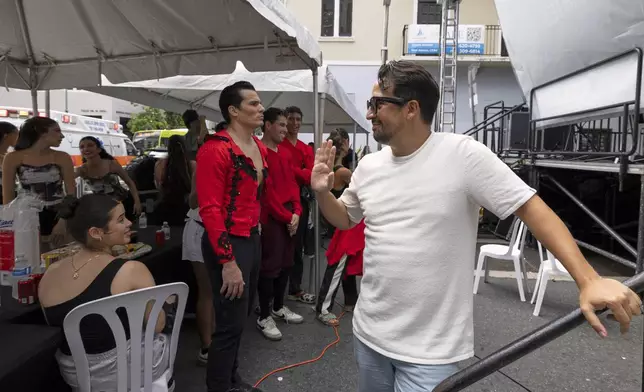 Lin-Manuel Miranda greets performers backstage during the closing event of the Flamboyan Arts Fund in San Juan, Puerto Rico, Saturday, Sept. 13, 2025. (AP Photo/Alejandro Granadillo)