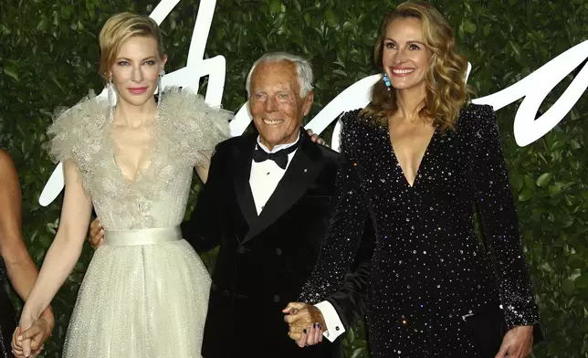 FILE - Actress Cate Blanchett, from left, designer Giorgio Armani, and actress Julia Roberts pose for photographers upon arrival at the British Fashion Awards in central London, Dec. 2, 2019. (Photo by Joel C Ryan/Invision/AP)