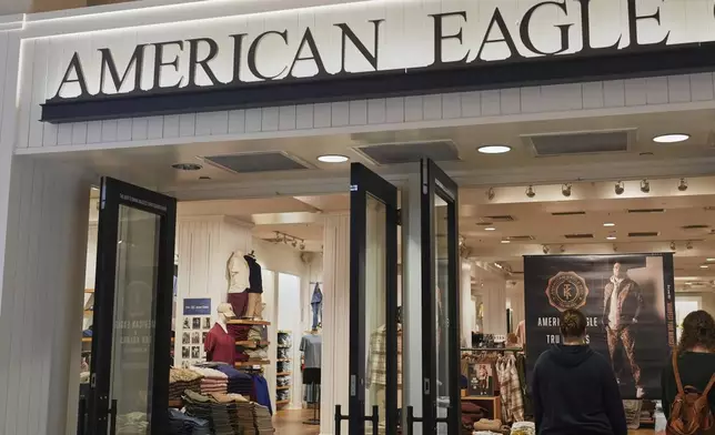 Shoppers enter an American Eagle Outfitters, Thursday, Sept. 4, 2025, in Bellevue, Wash. (AP Photo/Lindsey Wasson)
