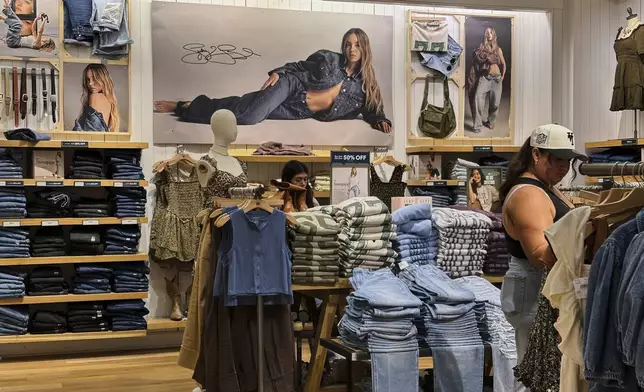 A Sydney Sweeney jeans ad is seen as shoppers browse at an American Eagle Outfitters, Thursday, Sept. 4, 2025, in Bellevue, Wash. (AP Photo/Lindsey Wasson)