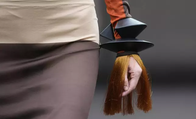 A model wears a creation part of the Ferragamo women's Spring-Summer 2026 collection, that was presented in Milan, Italy, Saturday, Sept. 27, 2025. (AP Photo/Luca Bruno).