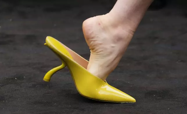 A model wears a creation part of the Ferragamo women's Spring-Summer 2026 collection, that was presented in Milan, Italy, Saturday, Sept. 27, 2025. (AP Photo/Luca Bruno).