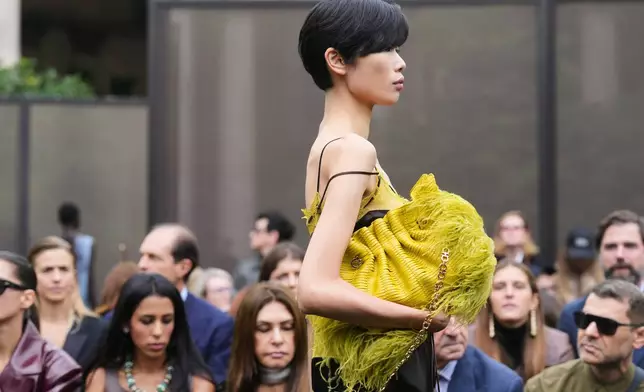 A model wears a creation part of the Ferragamo women's Spring-Summer 2026 collection, that was presented in Milan, Italy, Saturday, Sept. 27, 2025. (AP Photo/Luca Bruno).