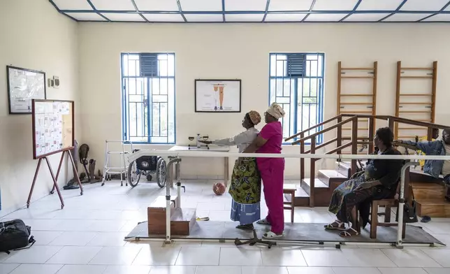 Amputes, many wounded by fighting in the region, exercise at an orthopedic center run by the Catholic church and supported by Red Cross in Goma, eastern Congo, Friday, Aug. 29, 2025. (AP Photo/Moses Sawasawa)