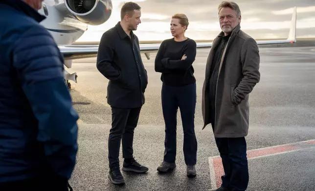 Chairman of the Naalakkersuisut Jens-Frederik Nielsen, centre left, welcomes Danish Prime Minister Mette Frederiksen, centre right, and her husband, Bo Tengberg, right, as they land at Nuuk airport in Greenland, on Tuesday, Sept. 23, 2025. (Mads Claus Rasmussen/Ritzau Scanpix via AP)