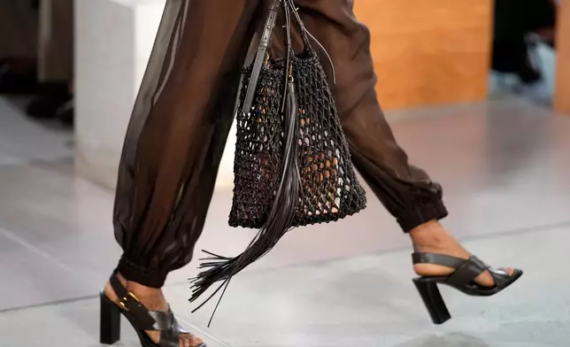 A model walks the runway during the Michael Kors Spring/Summer 2026 fashion show as part of New York Fashion Week on Thursday, Sept. 11, 2025, in New York. (Photo by Charles Sykes/Invision/AP)