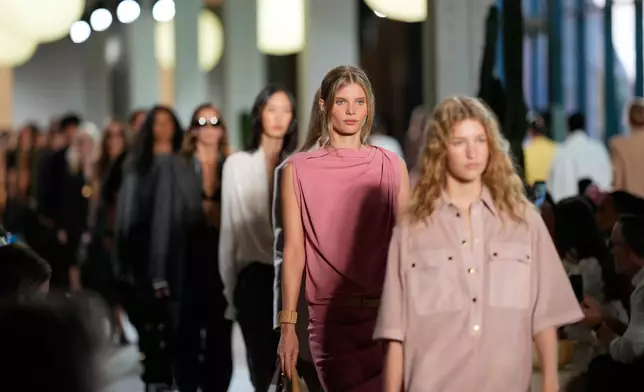 Models walk the runway during the Michael Kors Spring/Summer 2026 fashion show as part of New York Fashion Week on Thursday, Sept. 11, 2025, in New York. (Photo by Charles Sykes/Invision/AP)