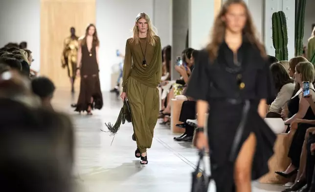 Models walk the runway during the Michael Kors Spring/Summer 2026 fashion show as part of New York Fashion Week on Thursday, Sept. 11, 2025, in New York. (Photo by Charles Sykes/Invision/AP)