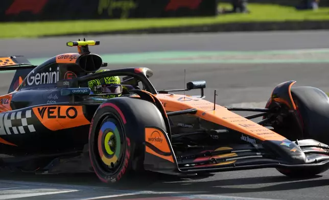 McLaren driver Lando Norris of Britain steers his car during the qualifying session ahead of the Italian Grand Prix at the Monza racetrack in Monza, Italy, Saturday, Sept. 6, 2025. (AP Photo/Luca Bruno)