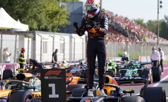 Red Bull driver Max Verstappen of the Netherlands celebrates his pole position after the qualifying session ahead of the Italian Grand Prix at the Monza racetrack in Monza, Italy, Saturday, Sept. 6, 2025. (AP Photo/Luca Bruno)