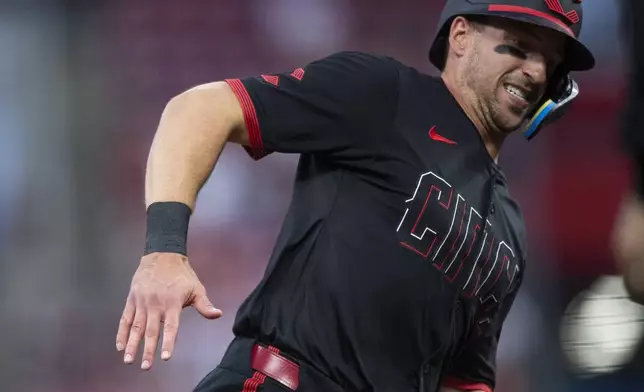 Cincinnati Reds' Spencer Steer rounds third base in the fourth inning of a baseball game against the New York Mets, Friday, Sept. 5, 2025, in Cincinnati. (AP Photo/Michael Swensen)