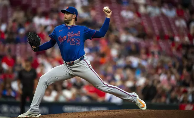 New York Mets pitcher David Peterson delivers in the second inning of a baseball game against Cincinnati Reds, Friday, Sept. 5, 2025, in Cincinnati. (AP Photo/Michael Swensen)