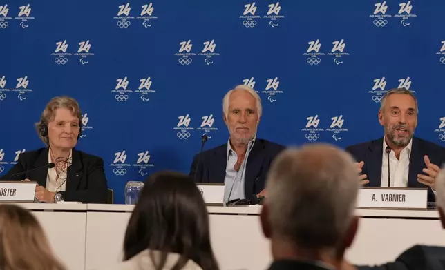 From left, Kristin Kloster, President of the IOC Coordination Commission, Giovanni Malago' and Andrea Varnier attend a news conference of the Organising Committee of the Olympic Winter Games Milano Cortina 2026, following the meeting of the IOC Coordination Commission, in Milan, Italy, Wednesday, Sept. 17, 2025. (AP Photo/Luca Bruno)