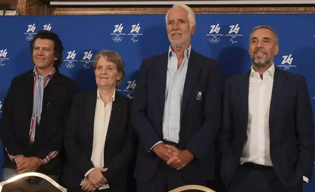 From left, Olympic Games Executive Director Christophe Dubi, member of the IOC Kristin Kloster, President of the Italian Olympic Committee Giovanni Malago' and CEO of Milano Cortina Andrea Varnier attend a news conference of the Organising Committee of the Olympic Winter Games Milano Cortina 2026, following the meeting of the IOC Coordination Commission, in Milan, Italy, Wednesday, Sept. 17, 2025. (AP Photo/Luca Bruno)