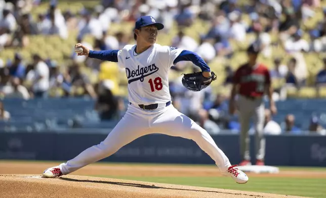 Los Angeles Dodgers starting pitcher Yoshinobu Yamamoto throws during the first inning of a baseball game against the Arizona Diamondbacks in Los Angeles, Sunday, Aug. 31, 2025. (AP Photo/Kyusung Gong)